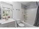 Clean bathroom features a tub and shower combo with tile accents and ample counter space at 4203 Fairington Village Dr, Lithonia, GA 30038