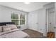 Light-filled bedroom boasts carpet floors, window, and ample closet space at 4203 Fairington Village Dr, Lithonia, GA 30038