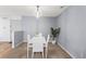 Contemporary dining area with white table set and stylish overhead lighting at 4203 Fairington Village Dr, Lithonia, GA 30038