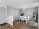 Spacious dining room featuring modern lighting and neutral tones at 4203 Fairington Village Dr, Lithonia, GA 30038