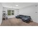 Spacious living room with neutral carpeting and comfortable seating at 4203 Fairington Village Dr, Lithonia, GA 30038