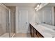 Bathroom with double vanity, frameless shower and tile flooring at 4349 Northmark Ln, Buford, GA 30518