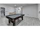 Nicely-appointed game room with a pool table and stylish wet bar at 4349 Northmark Ln, Buford, GA 30518