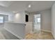 Hallway with neutral walls and carpet with an open door leading to another bedroom at 4349 Northmark Ln, Buford, GA 30518