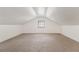 Spacious attic with carpeting, natural light, and white walls at 1932 Neely Ave, Atlanta, GA 30344