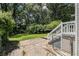 Large backyard with patio, stairs, and lush greenery at 1932 Neely Ave, Atlanta, GA 30344