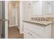 Bathroom featuring a modern vanity with granite countertop and updated fixtures at 1932 Neely Ave, Atlanta, GA 30344