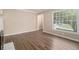Bright living room with hardwood floors and fresh paint, basking in natural light at 1932 Neely Ave, Atlanta, GA 30344