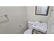 Powder bath with a small sink and mirror at 508 Jaywood Dr, Stone Mountain, GA 30083