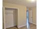 Bedroom with an open closet and wood-look flooring at 508 Jaywood Dr, Stone Mountain, GA 30083