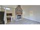 Living room showcasing stone fireplace and wood-look floors at 508 Jaywood Dr, Stone Mountain, GA 30083