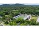 Scenic aerial view of a football field surrounded by lush greenery and residential areas, showcasing the community at 59 Oakmont Nw Dr, Marietta, GA 30064