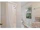 Bright bathroom featuring a stand up shower, granite countertop and garden window at 59 Oakmont Nw Dr, Marietta, GA 30064