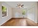 Light and airy bedroom featuring hardwood floors, a ceiling fan and double windows at 59 Oakmont Nw Dr, Marietta, GA 30064