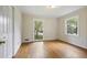 Bright bedroom featuring hardwood floors, neutral walls, and multiple windows at 59 Oakmont Nw Dr, Marietta, GA 30064