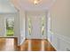 Light and airy foyer with hardwood floors, paneled walls, and sidelights flanking the front door at 59 Oakmont Nw Dr, Marietta, GA 30064