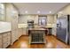 Well-lit kitchen with stainless steel appliances, light cabinets and a butcher block island at 59 Oakmont Nw Dr, Marietta, GA 30064