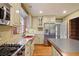Bright kitchen featuring stainless appliances, granite counters, a red sink and hardwood floors at 59 Oakmont Nw Dr, Marietta, GA 30064