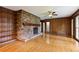 Spacious living room features hardwood floors, built-in shelves, and brick fireplace at 59 Oakmont Nw Dr, Marietta, GA 30064