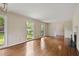 Large living room features fireplace and large windows offering views of the landscaped yard at 59 Oakmont Nw Dr, Marietta, GA 30064