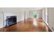 Spacious living room with hardwood floors, fireplace with black hearth, and large window at 59 Oakmont Nw Dr, Marietta, GA 30064