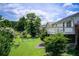 Expansive backyard with a lush lawn, mature trees, and a charming deck perfect for outdoor gatherings at 8 Southview Dr, Cartersville, GA 30121