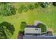 Large backyard with well-manicured lawn, mature trees, and a seating area perfect for outdoor enjoyment at 8 Southview Dr, Cartersville, GA 30121