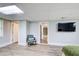 Basement room with a chair and television, view to other basement rooms at 8 Southview Dr, Cartersville, GA 30121