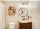 Cozy bathroom with stylish fixtures, vanity, mirror, shelving and neutral walls at 8 Southview Dr, Cartersville, GA 30121
