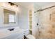 Bathroom featuring a vanity, toilet, and walk-in shower with decorative tile at 8 Southview Dr, Cartersville, GA 30121