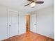 Bright bedroom with hardwood floors, a ceiling fan, and white trim at 8 Southview Dr, Cartersville, GA 30121