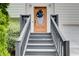 Close-up of the front door with black wreath, steps, and gray handrails at 8 Southview Dr, Cartersville, GA 30121