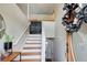 Home entryway and staircase with wreath, welcome sign and coat rack at 8 Southview Dr, Cartersville, GA 30121