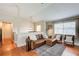 Comfortable living room features a leather sectional, wood floors, natural light, and decorative rug at 8 Southview Dr, Cartersville, GA 30121