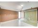 An empty room with mocha-colored walls and white tile flooring, ready for customization and creative possibilities at 8 Southview Dr, Cartersville, GA 30121