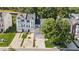 Attractive townhome with attached garage, driveway parking, lawn, and mature trees at 1714 Indian Way, Cumming, GA 30040