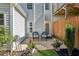 The backyard features an outdoor patio with patio furniture, a privacy fence, and a flower bed at 1714 Indian Way, Cumming, GA 30040
