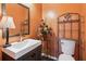 Stylish powder room with modern vanity and decorative accents at 1714 Indian Way, Cumming, GA 30040