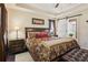 Large main bedroom with a sliding barn door to the ensuite bathroom at 1714 Indian Way, Cumming, GA 30040