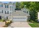Well-maintained two-story townhome featuring an attached garage and lovely curb appeal at 1714 Indian Way, Cumming, GA 30040