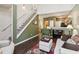 Bright living room flows into kitchen area with a charming staircase at 1714 Indian Way, Cumming, GA 30040