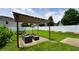 Backyard featuring a pergola with seating, trampoline, basketball hoop and well-kept lawn at 400 Silver Spring St, Dallas, GA 30157