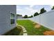 Spacious backyard with a well-maintained lawn and a pristine white fence at 400 Silver Spring St, Dallas, GA 30157