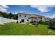 Expansive backyard with pergola, outdoor seating, trampoline, and well-manicured lawn at 400 Silver Spring St, Dallas, GA 30157