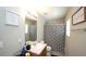 Full bathroom with shower/tub combo, framed art, and modern vanity with drawers at 400 Silver Spring St, Dallas, GA 30157