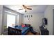 Cozy bedroom with a ceiling fan, window, and a well decorated wall at 400 Silver Spring St, Dallas, GA 30157