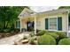 Charming clubhouse with yellow siding, green shutters, manicured landscaping, providing community space at 400 Silver Spring St, Dallas, GA 30157