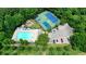 Aerial view of community pool and tennis courts surrounded by green trees at 400 Silver Spring St, Dallas, GA 30157