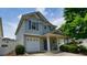 Two-story home with a covered front porch, attached garage, and manicured landscaping at 400 Silver Spring St, Dallas, GA 30157