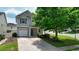 Charming two-story home with a well-manicured lawn, attached garage, and inviting entryway at 400 Silver Spring St, Dallas, GA 30157